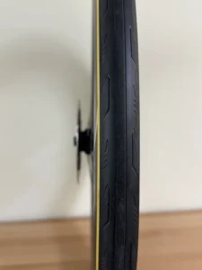 The narrow view of a clean bicycle tire showing tread pattern.
